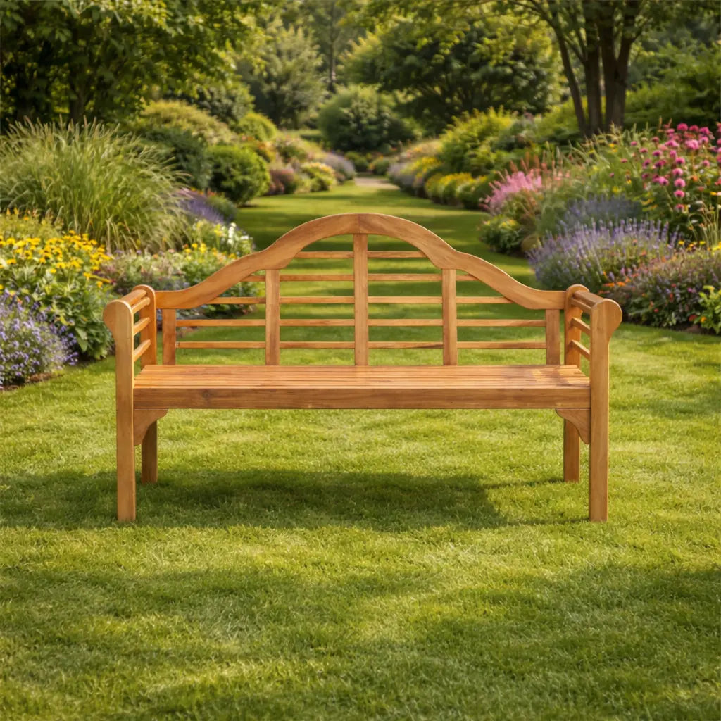 Front view of a 3-seater hardwood garden bench overlooking a long landscaped garden path with colourful flower borders