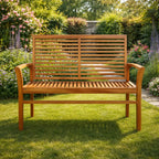 Front View of 2 Seater Teak Wood Garden Bench on Grass in Garden